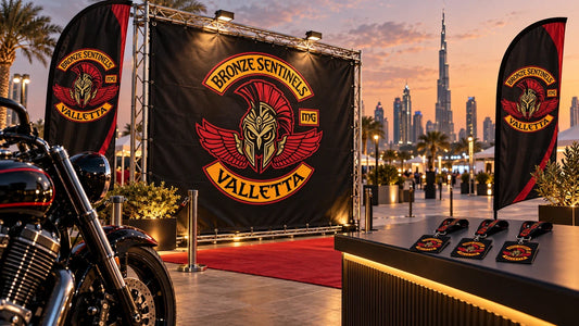 Bronze Sentinels Valletta motorcycle club welcome point with logo event gear at a modern Dubai exhibition venue.