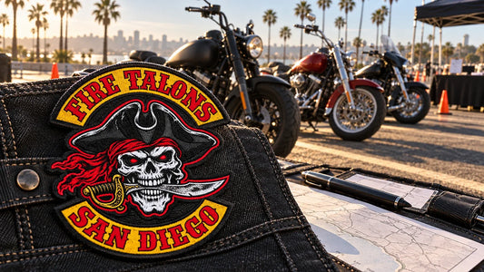 Fire Talons San Diego event patch beside parked V-twin motorcycles at a one-site rally arrival area.