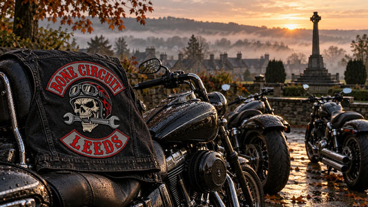 Bone Circuit Leeds motorcycle club vest beside parked V-twin cruisers before a Remembrance ride.