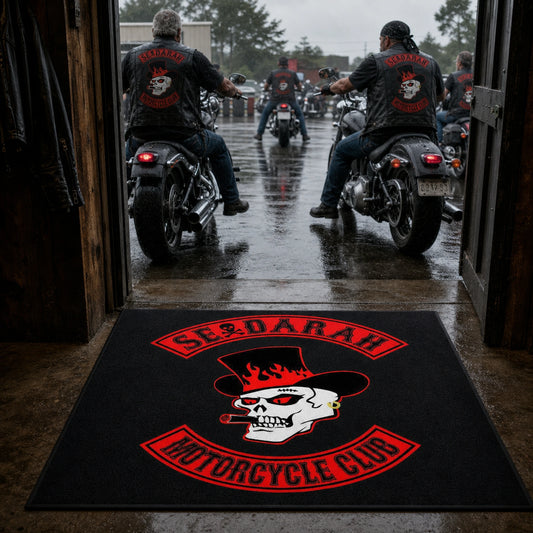 A custom motorcycle club entrance rug welcomes riders arriving at a clubhouse.