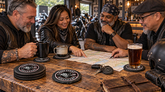 Motorcycle club members using custom leather and slate coasters around a clubhouse meeting table.