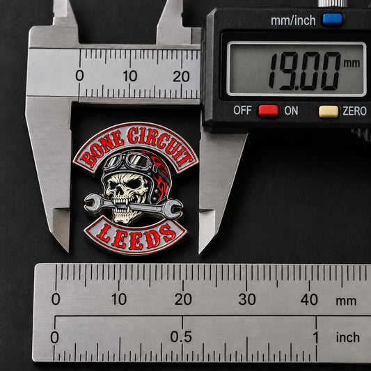 Compact Bone Circuit motorcycle club enamel pin measured at 0.75 inch or 19 millimeters.