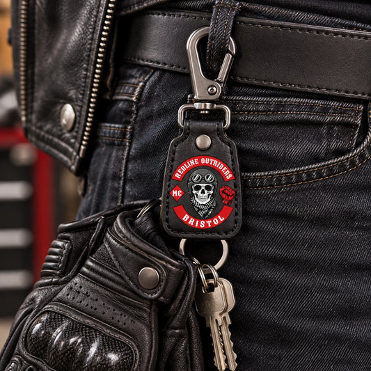 Custom biker belt-clip key keeper with an authorized club logo on a leather tab and gunmetal hardware.