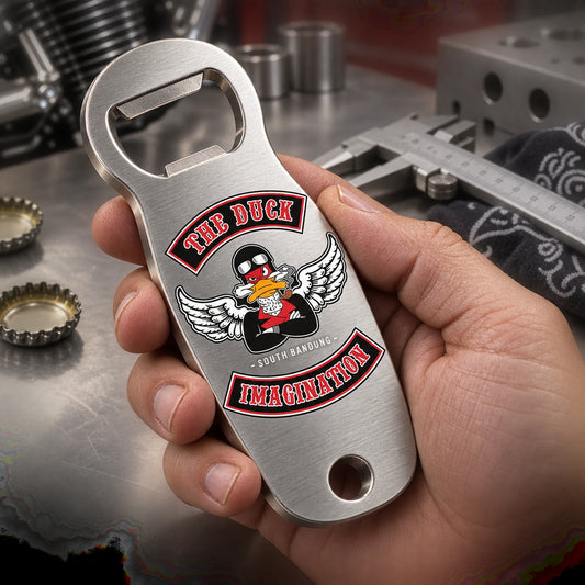 Solid brushed stainless steel motorcycle club bottle opener under workshop inspection.