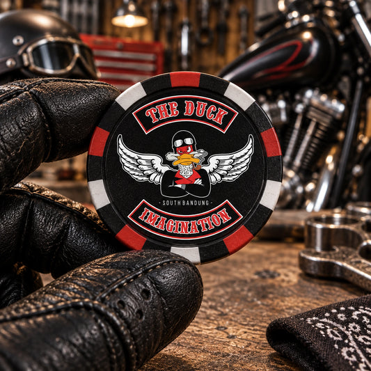 Solid composite motorcycle club poker chip shown at realistic scale in a rider's hand.