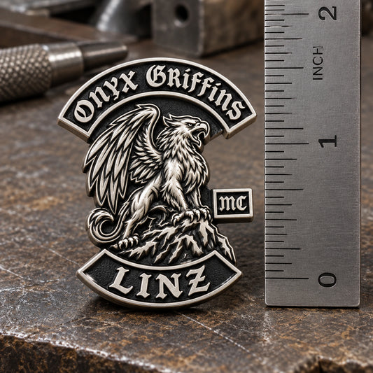 Detailed one-and-a-half-inch ONYX GRIFFINS sculpted pin shown beside a metal ruler.