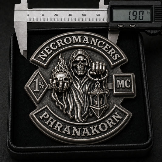 One-piece antique silver NECROMANCERS collector pin with deeply sculpted hooded skull relief measured at 1.90 inches in a presentation box.