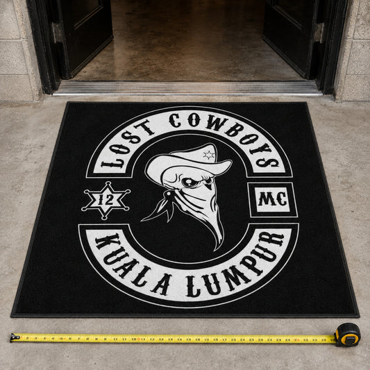 A rectangular custom motorcycle club rug is measured at a clubhouse entrance.