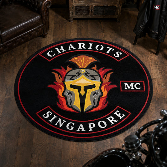 An oval motorcycle club rug presents approved badge-inspired artwork on a clubhouse floor.