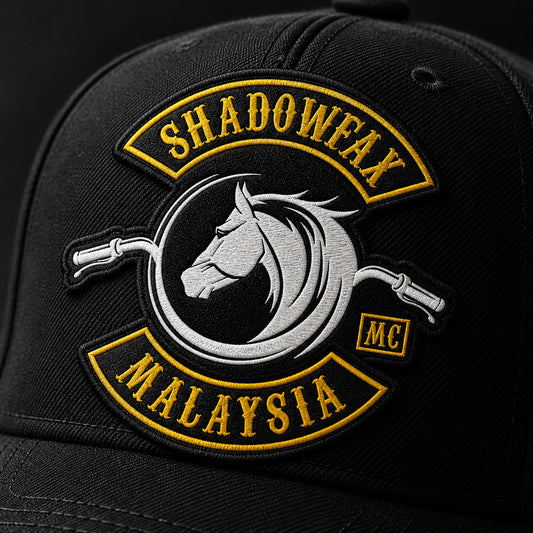 Close view of flat embroidery reproducing an authorized motorcycle club logo on a black cap.