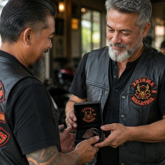 New motorcycle club member receiving a personalized leather keychain with an authorized club emblem.