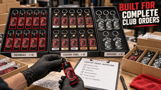 Bulk motorcycle club keychain order with an authorized logo being inspected and packed for chapter members.