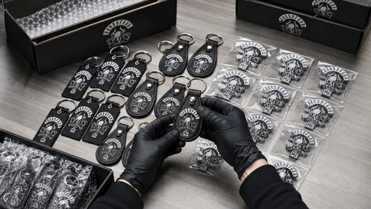Bulk motorcycle club keychain order with an authorized logo being inspected and packed for chapter members.