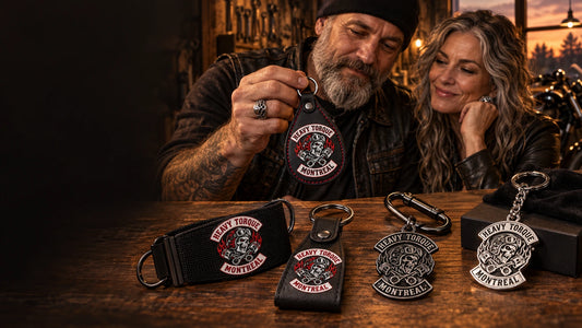 Motorcycle club members reviewing custom textile, leather, metal and silver keychains with an authorized club logo.