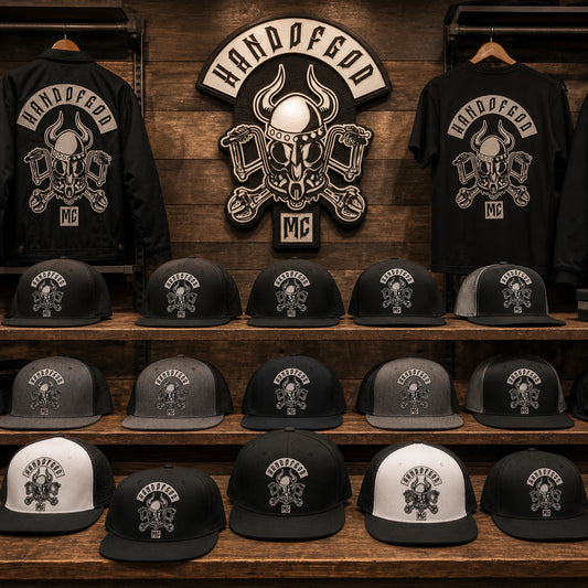 Custom motorcycle club caps with an authorized emblem arranged for clubhouse merchandise.