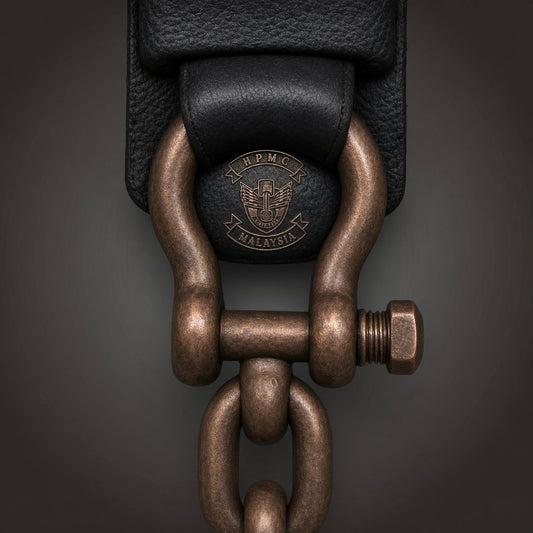 Heavy mechanical shackle connector featuring an authorized motorcycle club logo.