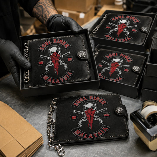 Finished motorcycle club wallets with an authorized logo packed for worldwide delivery after production approval.