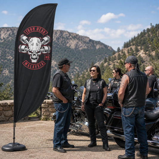 Designed For Motorcycle Culture: custom motorcycle club feather flag shown in mature mixed-gender road crew at a mountain turnout with unbranded American V-twin touring motorcycles.