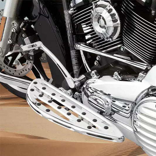 Chrome Arlen Ness front footboards installed on a Harley Touring motorcycle