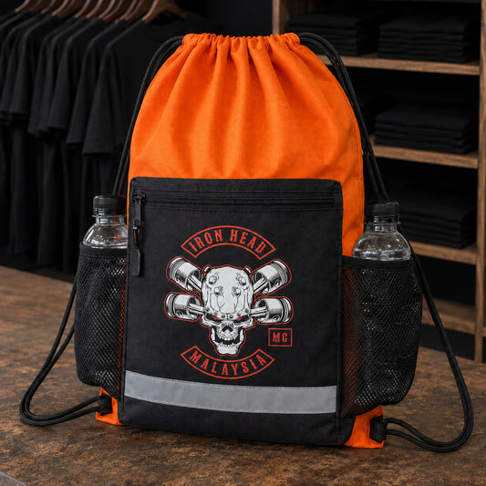 A custom motorcycle club drawstring bag is displayed at a busy bike-week merchandise booth.