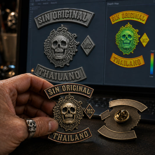 Aged bronze 3D club pin beside a digital relief model at a metal design workstation.