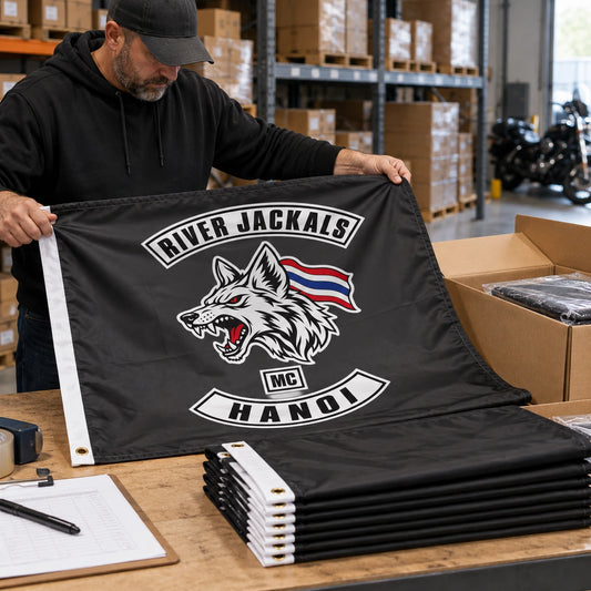 Motorcycle club members use a custom rectangular flag for bulk club orders in a realistic American V-twin setting.