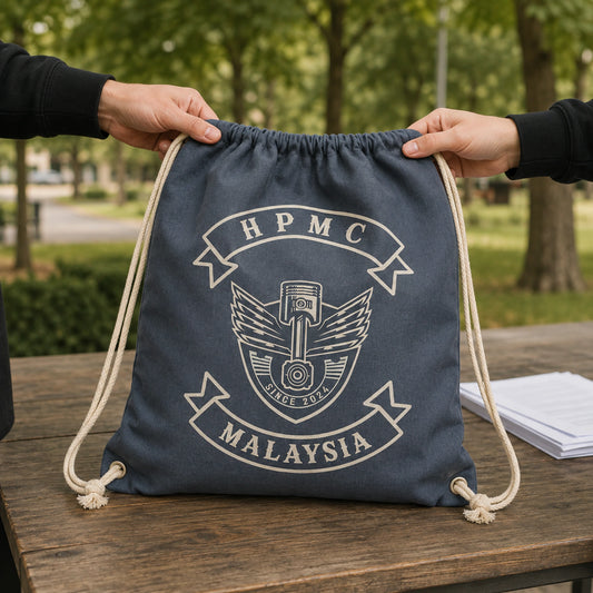 Motorcycle club riders receive custom participant drawstring bags at a community charity ride.