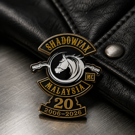 Classic metal motorcycle club anniversary pin combining an official logo, milestone number and years.
