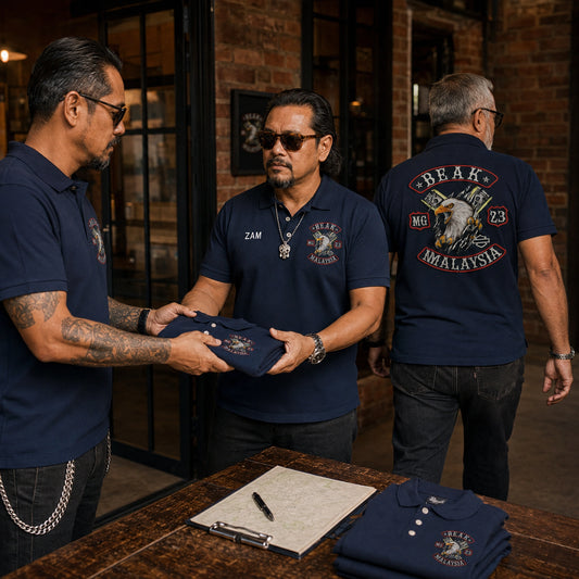 Beak MG members at a clubhouse entrance in navy polos with chest names and emblems plus a large back club logo.