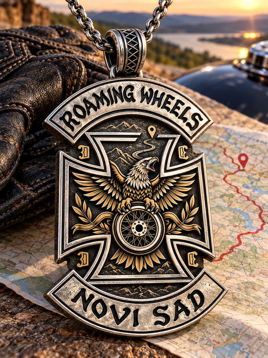 Roaming Wheels motorcycle club zinc alloy pendant beside a road map for a club run and rally trip.