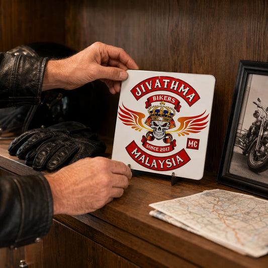 Compact motorcycle club metal sign displayed with rider memorabilia on a clubhouse shelf.