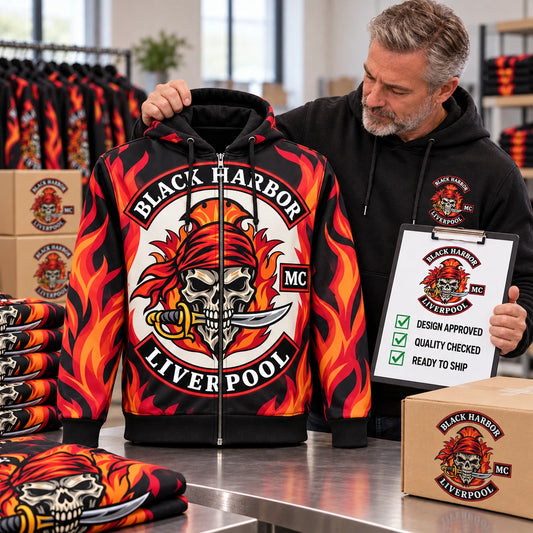 Club representative approving the finished Black Harbor Liverpool full-zip flame hoodie for production.
