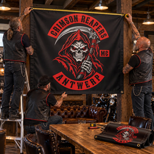 A setup crew measuring and positioning an extra-wide custom motorcycle club banner.