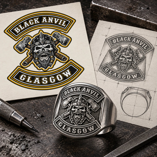 Approved motorcycle club artwork, ring sketch and stainless steel ring concept arranged on a design desk.