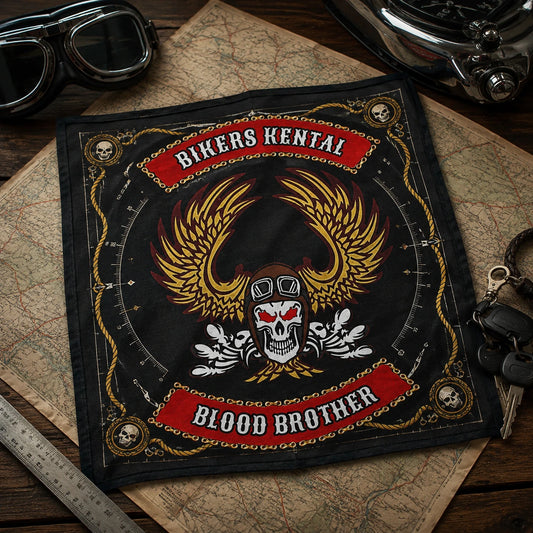 Custom motorcycle club bandana featuring the authorized @BIKERS KENTAL identity in compact bandana measured on a map-covered road-trip table beside goggles and motorcycle keys.