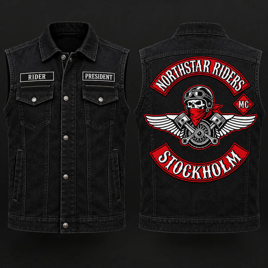 Black denim motorcycle club cut with concealed front closure and approved patch layout.