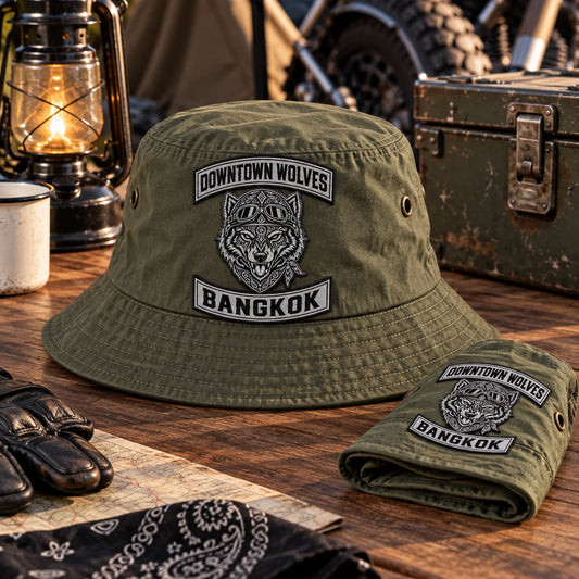 Lightweight olive motorcycle club bucket hat with approved woven patch and packable construction.