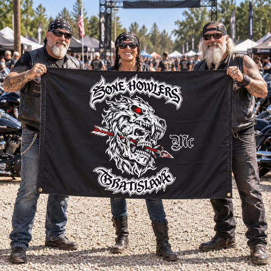 A road captain and riders hold a complete classic custom flag at a gravel motorcycle rally entrance.