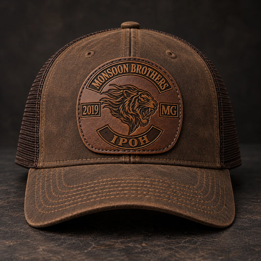 Debossed motorcycle club leather patch hat with recessed logo detail.