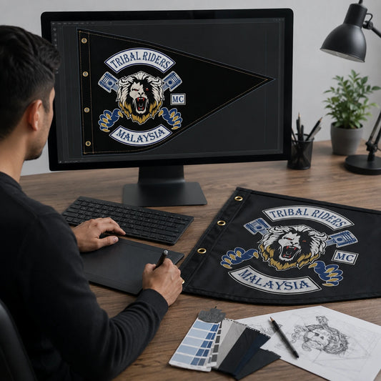 A designer prepares a custom triangle flag layout using the motorcycle club's approved logo.