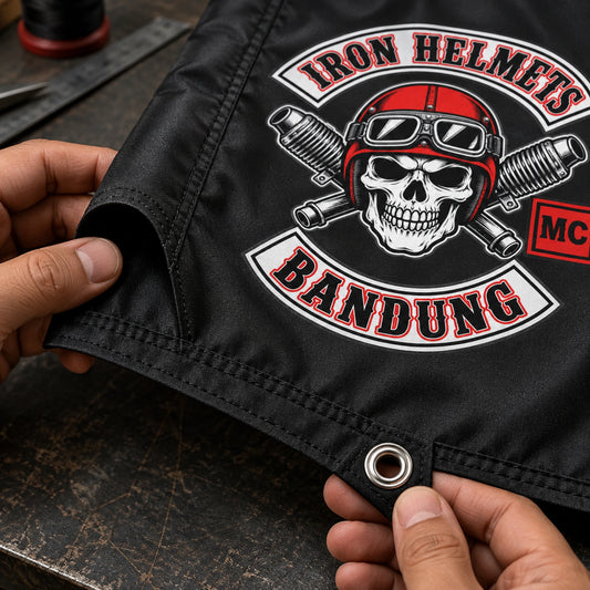 Close view of reinforced stitching, a metal eyelet and a pole sleeve on a custom motorcycle club flag.