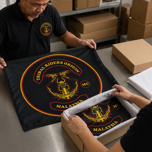 A finished motorcycle club rally flag passes quality inspection before secure worldwide shipping.