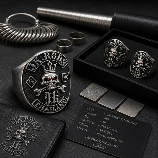 Finished custom motorcycle club rings arranged in a production tray with presentation boxes and shipping preparation details