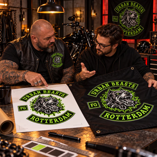 Club officer and designer reviewing a custom swallowtail flag proof for a motorcycle club.