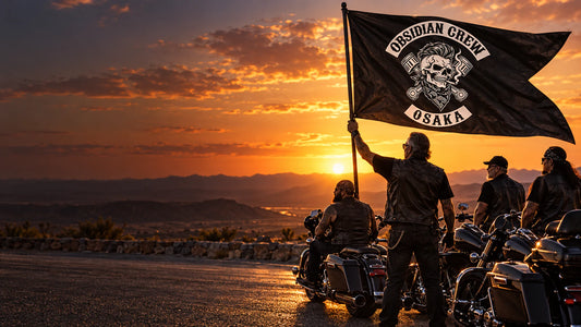 Motorcycle club riders holding a custom swallowtail flag at a desert overlook for a motorcycle club.