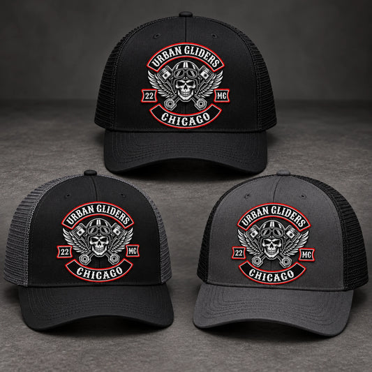 Black and charcoal motorcycle club trucker hats in coordinated color combinations.