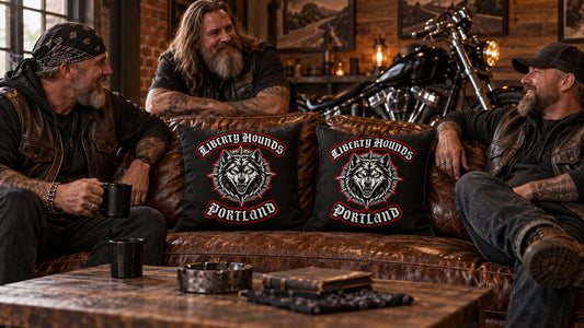Motorcycle club members gather around custom logo pillows in a clubhouse lounge.