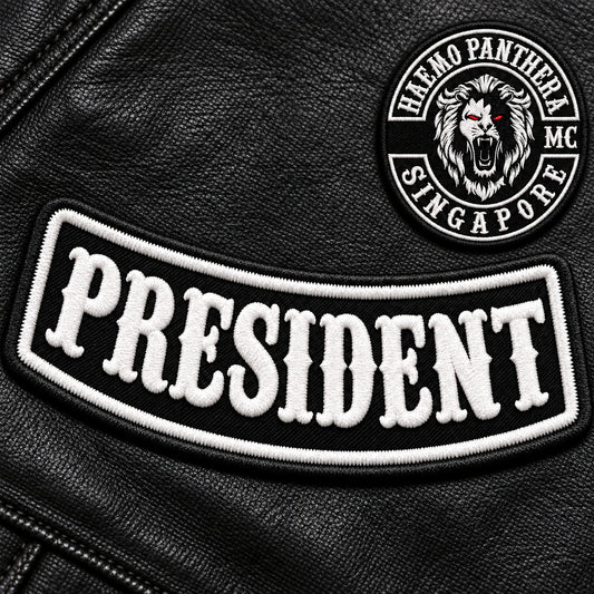 Custom motorcycle club officer-title patch with bold embroidered lettering.