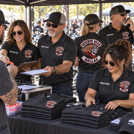 Seventh Gear Dallas motorcycle club registration, event and merchandise support staff work at a rally operations counter in clearly identified custom polos.