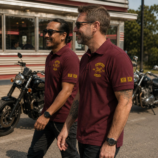 Two Borneo Distons members walk past a roadside diner in burgundy polos with sleeve details and left chest emblems.